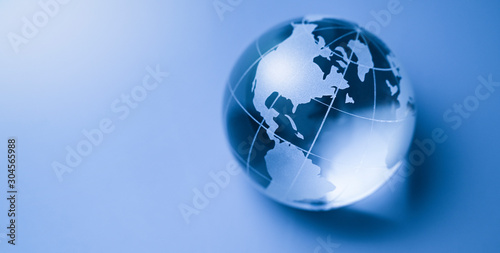 World economy and trade earthball or glass globe from usa, canada and continent new year 2024 on blue background.