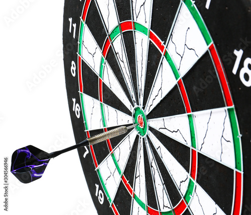 Dartboard with hit bullseye on white background, closeup