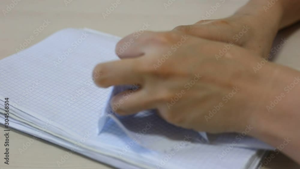 Hands wresting the sheet of paper and making paper ball after mistake during writing. Footage. Hands wresting the sheet of paper and making paper ball after mistake during writing. Footage.