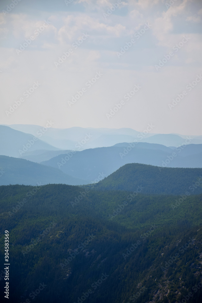 View of multiple levels of moutains from the top of the Acrople des Draveurs trail at the Hautes-Gorges-de-la-Rivière-Malbaie National Park (SEPAQ), Charlevoix Region, Quebec, Canada