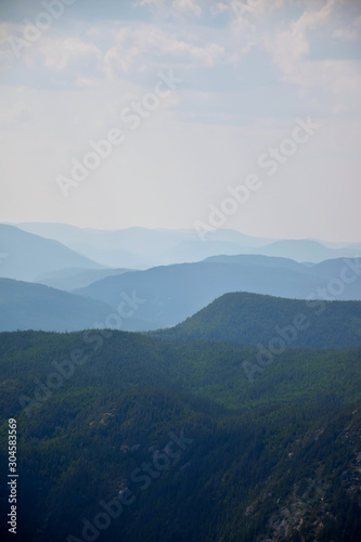 View of multiple levels of moutains from the top of the Acrople des Draveurs trail at the Hautes-Gorges-de-la-Rivi  re-Malbaie National Park  SEPAQ   Charlevoix Region  Quebec  Canada
