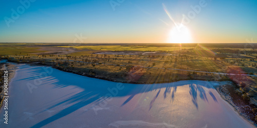 Sunset over desert and salt lake in Australia - aerial panorama © Greg Brave