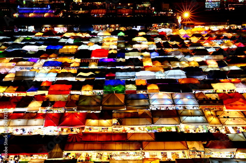 Colorful Night view of Train Night Market Ratchada, Bangkok, Thailand The famous Bangkok night Market. © leochen66