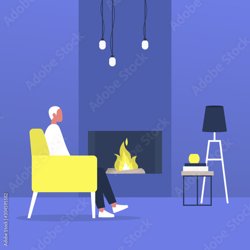 Young male character sitting next to a fireplace, modern living room interior © nadia_snopek