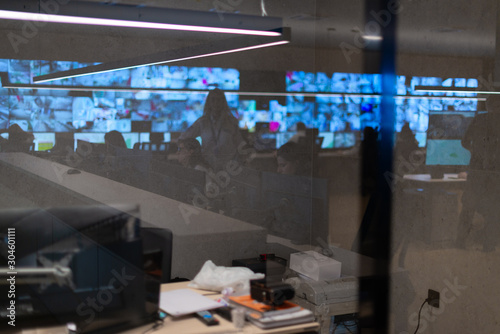 Reflection of a security agency team working at the data center photo