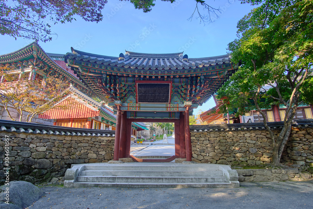 Scenic view of entrance to buddhistic temple in Jirisan national park in Republic of Korea. Beautiful summer sunny look of gate in asian style to religion object in South Korea Scenic view of entrance to buddhistic temple in Jirisan national park in Republic of Korea. Beautiful summer sunny look of gate in asian style to religion object in South Korea