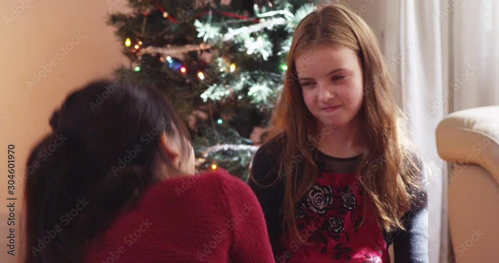 Young girl pouts and is upset after opening a present on Christmas - slow motion - shot on RED Young girl pouts and is upset after opening a present on Christmas - slow motion - shot on RED