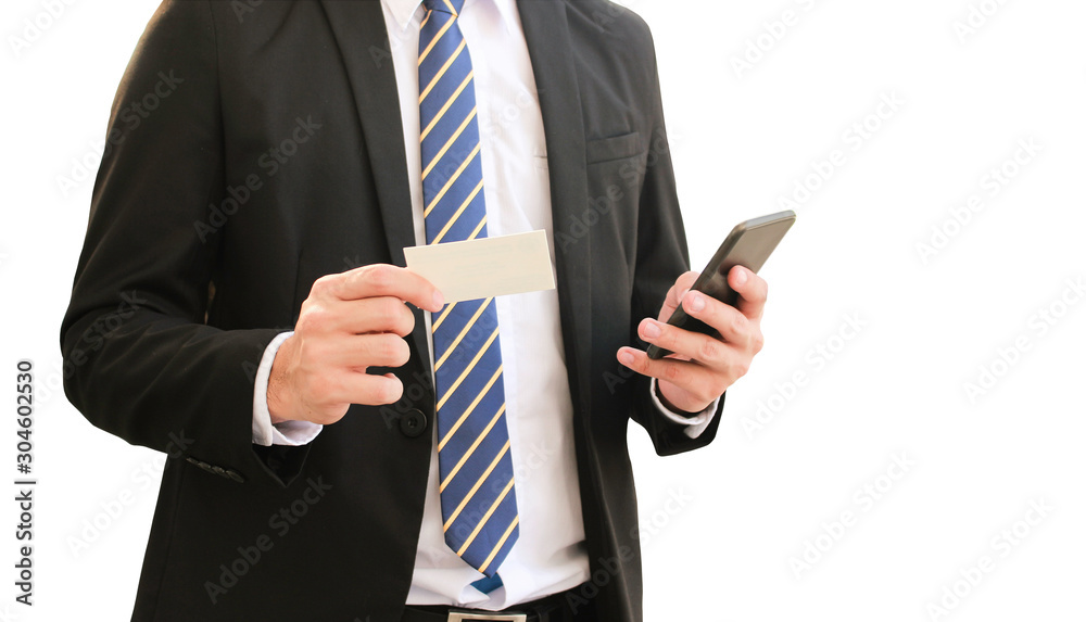 Businessman holding blank business card while using mobile phone isolated on white background Businessman holding blank business card while using mobile phone isolated on white background