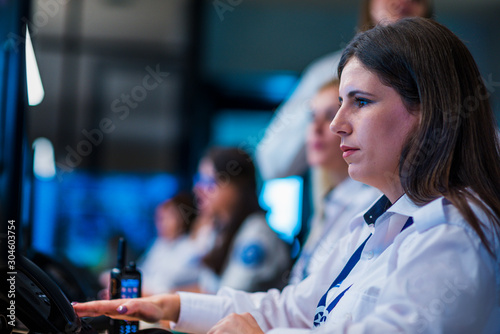 Εκτύπωση καμβά Security guards working in surveillance room