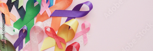 colorful ribbons on pink panoramic banner background, cancer awareness, World cancer day, Autism awareness
