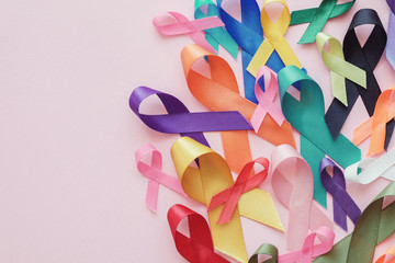 colorful ribbons on pink background, world cancer day,  World Autism Awareness Day, Autism spectrum concept