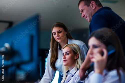 Canvas Print Security guards working in surveillance room