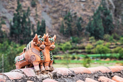 Pucara's bulls peruvian fertility icon on the roof of a andes mountain house