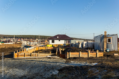 Foundation construction for a house in a cottage village. Autumn, sunny © flyural66