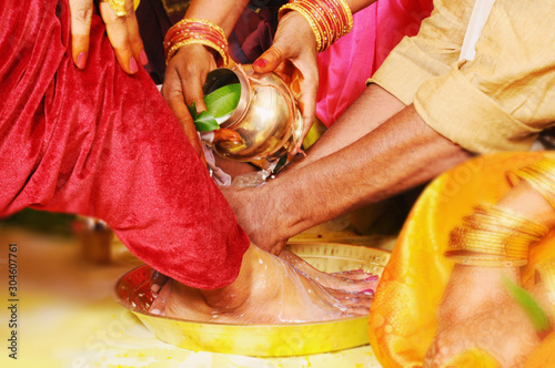 Fotografie Father-in-law is washing son-in-law's feet