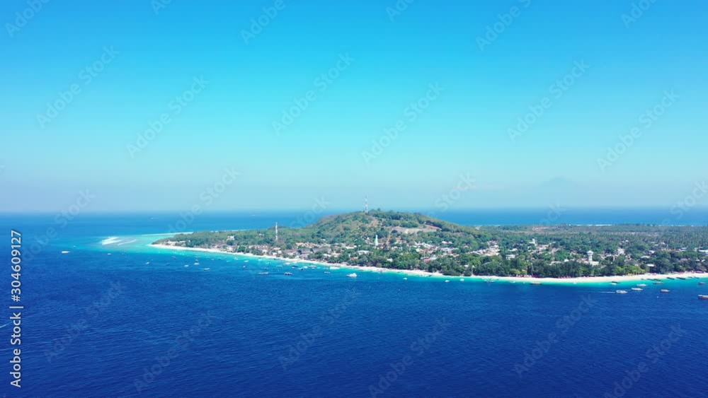 Bali, Indonesia, Aerial panorama, tropical islands in the middle of the ocean with a small hill, luxury resorts, summer vacation motion background Bali, Indonesia, Aerial panorama, tropical islands in the middle of the ocean with a small hill, luxury resorts, summer vacation motion background