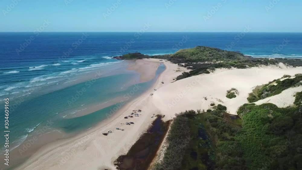 Drone Panning Above Fraser Island Australia Coastline With Blue Ocean, White Sandy Beach And Lush Green Forest Drone Panning Above Fraser Island Australia Coastline With Blue Ocean, White Sandy Beach And Lush Green Forest