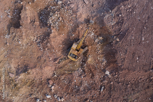 Aerial view of an excavator working on a quarry