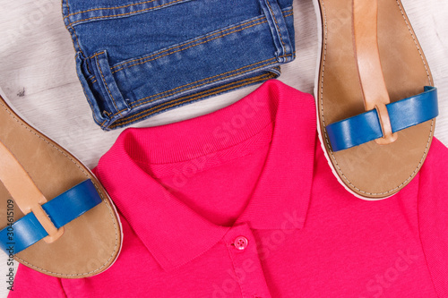 Womanly leather sandals, jeans and shirt, comfortable clothing concept