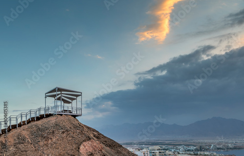 Scenic point of view with decorative walkway to stone hill in public park of ...