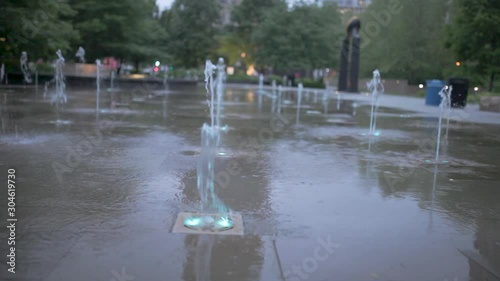 Water Shooting up from the Ground in a City Park