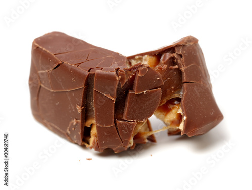 Chocolate peanut candy on white background
