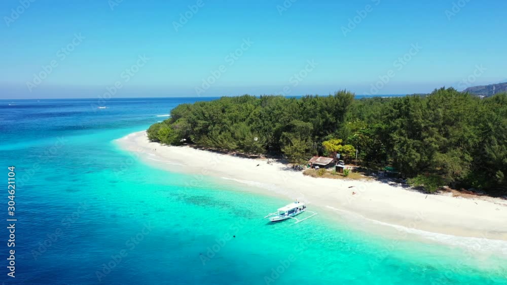 tropical island beach background. White sand , boats and shadow of the trees tropical island beach background. White sand , boats and shadow of the trees