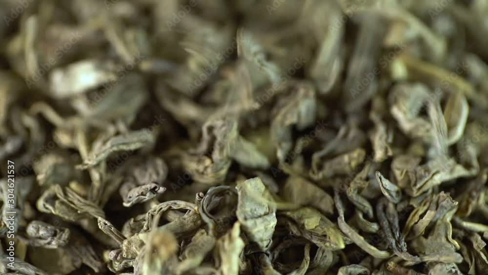 Macro close-up shot: Large-leaf black tea. A fall. Slow motion. Macro close-up shot: Large-leaf black tea. A fall. Slow motion.