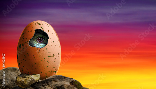 Fototapeta Naklejka Na Ścianę i Meble -  Dinosaur egg in a cliff hatching with baby dinosaur inside the egg