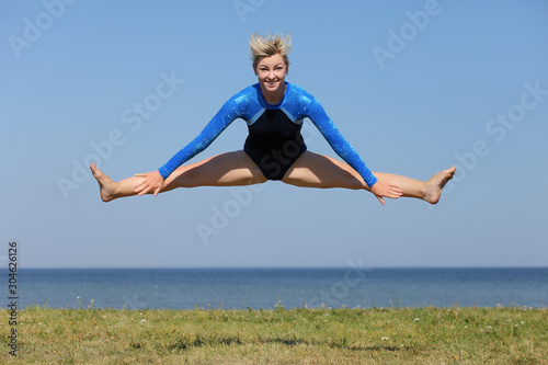 girl gymnast in a blue bodysuit