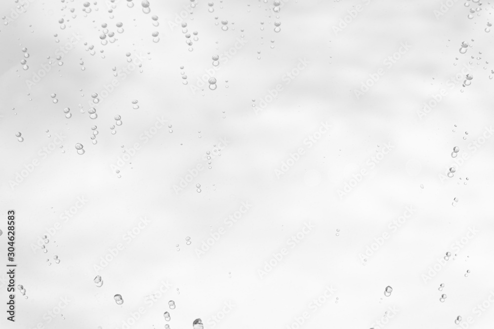 Raindrop water dew drop on glass wet white gray blue background. Raindrop water dew drop on glass wet white gray blue background.