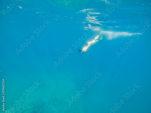 woman in flipper view underwater beach vacation