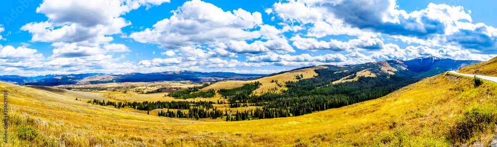 The grasslands and mountain ranges viewed from the Grand Loop Road between Canyon Village and Tower Junction in Yellowstone National Park, Wyoming, United Sates