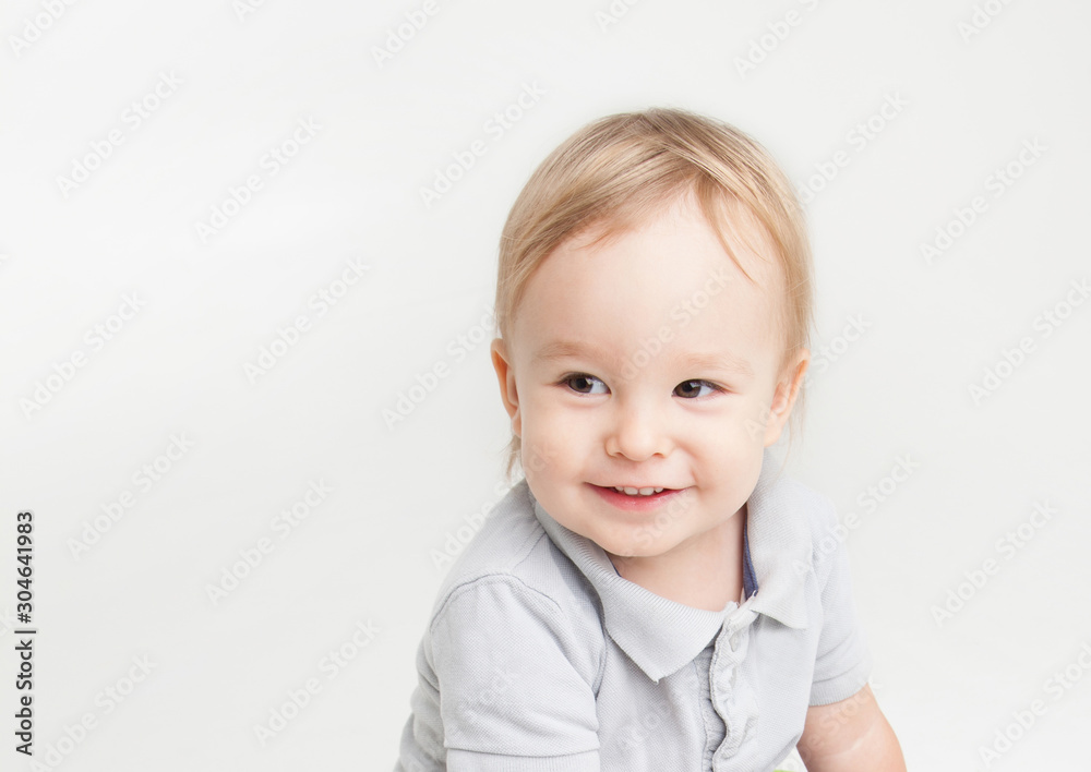 Little boy toddler smiling on white background 