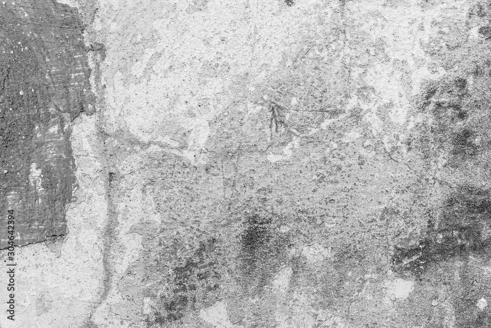Texture of a concrete wall with cracks and scratches which can be used as a background Texture of a concrete wall with cracks and scratches which can be used as a background