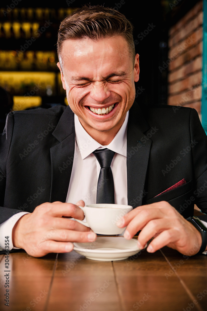 Angry businessman drinks coffee Angry businessman drinks coffee