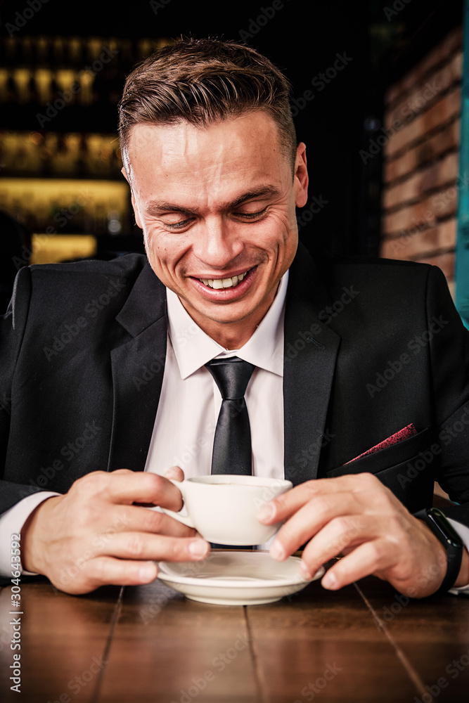 Angry businessman drinks coffee Angry businessman drinks coffee