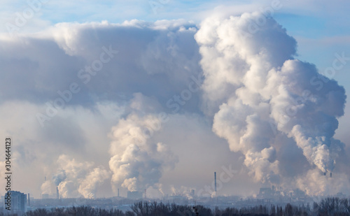 Smoke from the chimneys of a metallurgical plant at dawn