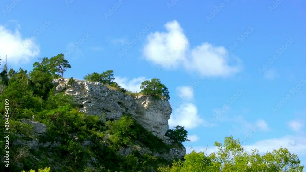Limestone cliff under blue sky Limestone cliff under blue sky