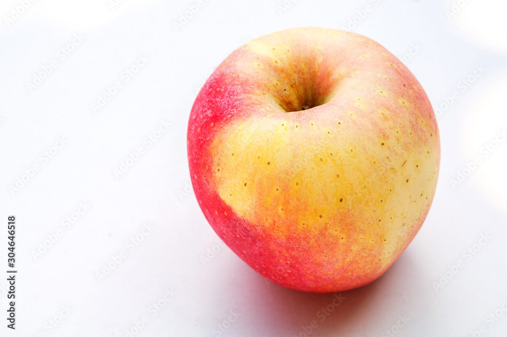 A fresh apple isolated on a white background