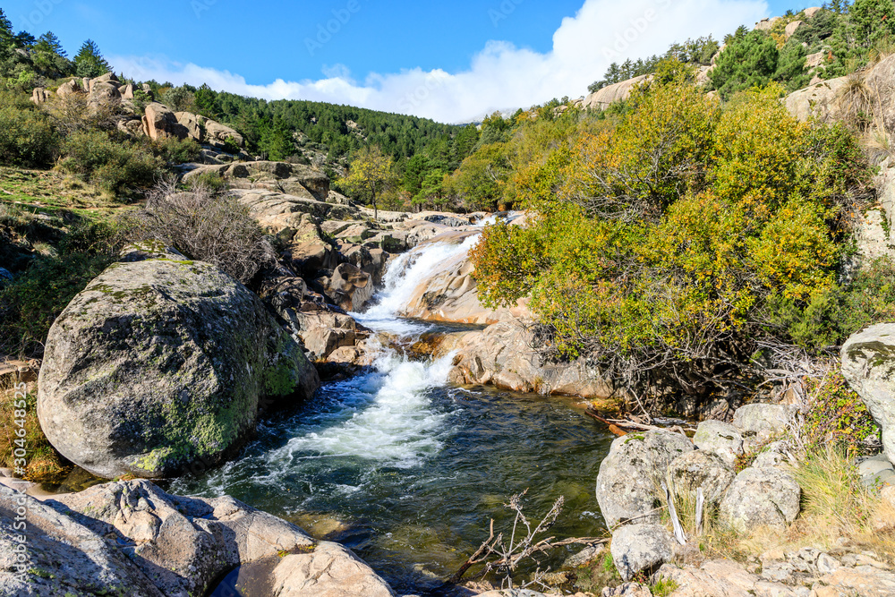 River in La Pedriza, in the mountains of Madrid, area characterized by large granite rocks River in La Pedriza, in the mountains of Madrid, area characterized by large granite rocks