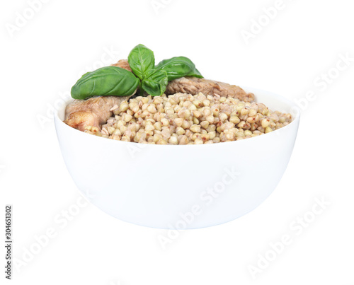 Tasty buckwheat porridge with meat isolated on white