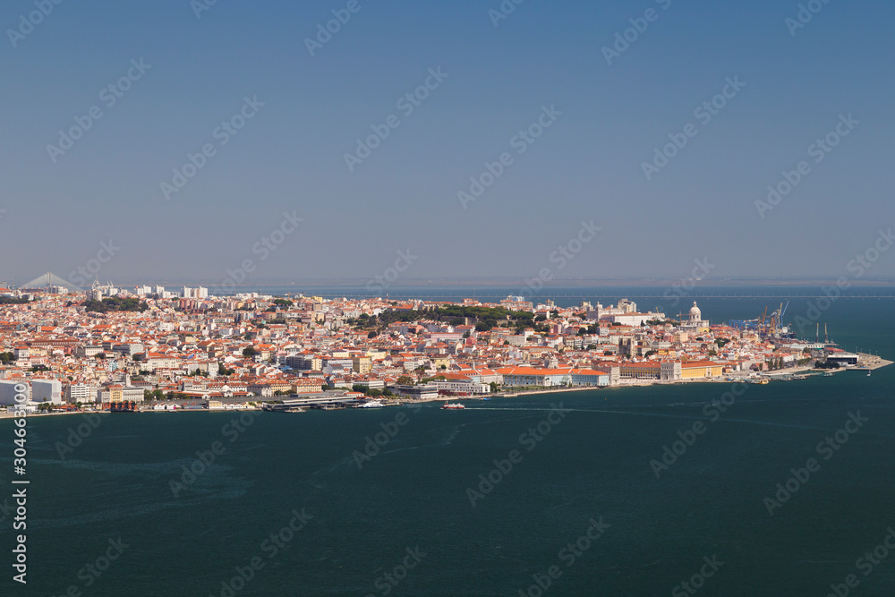 City of Lisbon and Tagus River in Portugal viewed slightly from above on a sunny day in the summer.