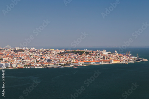 City of Lisbon and Tagus River in Portugal viewed slightly from above on a sunny day in the summer.