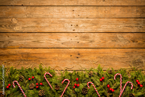 Wooden christmas background with red and green decorative ornament