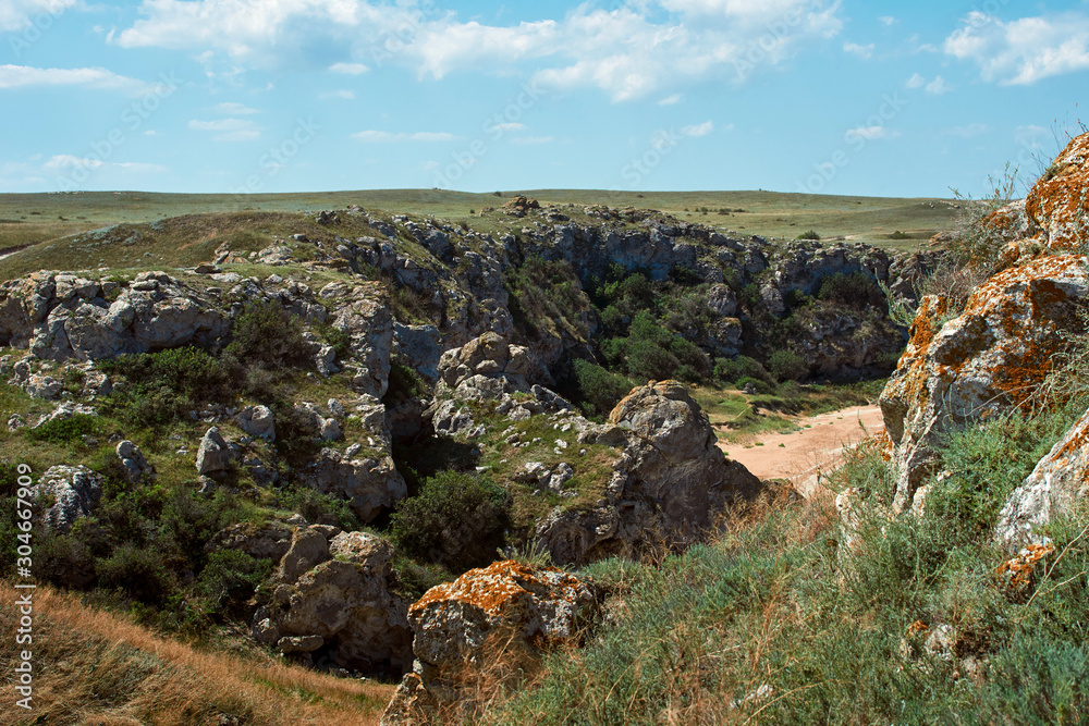 Scenic view of huge cliffs. Peaked rocks and cliffs on the seashore