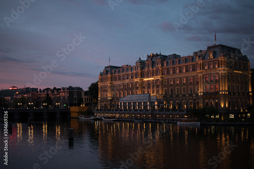 Canvas Print Amstel Hotel in Amsterdam during sunset