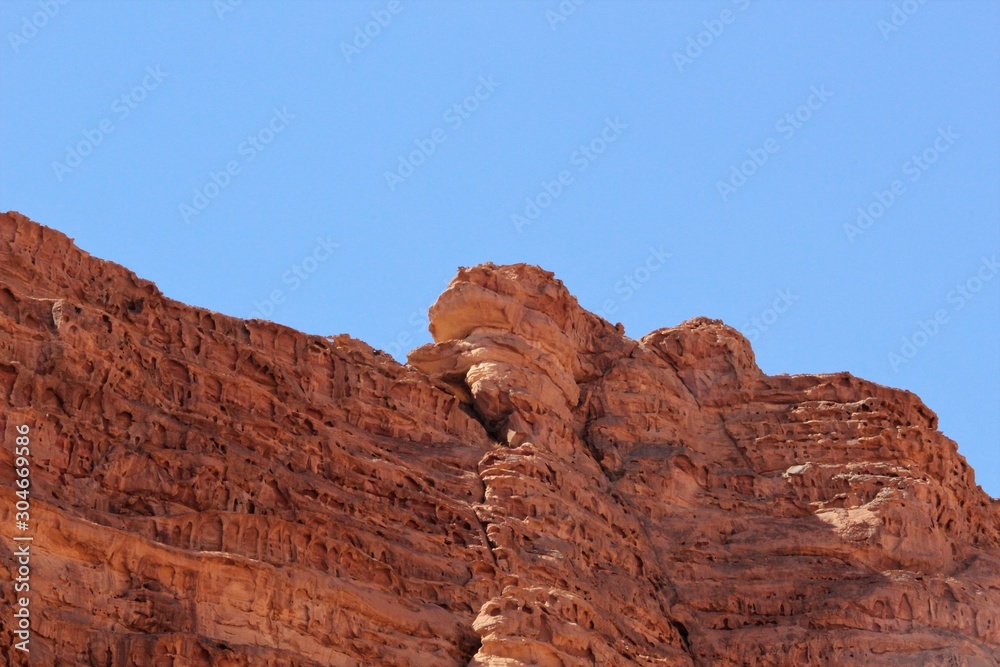 Fototapeta premium evocative wind-eroded mountains in the Wadi Rum desert