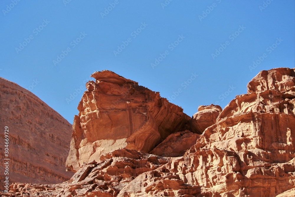evocative wind-eroded mountains in the Wadi Rum desert evocative wind-eroded mountains in the Wadi Rum desert
