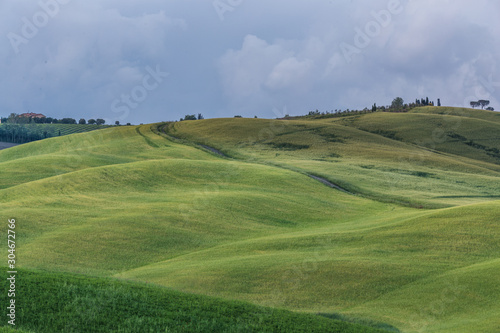 Beautiful countryside landscapes in Tuscany with rolling hills during the sunset